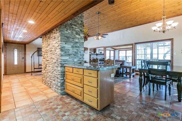 kitchen with wooden ceiling, high vaulted ceiling, dark stone counters, ceiling fan with notable chandelier, and hanging light fixtures