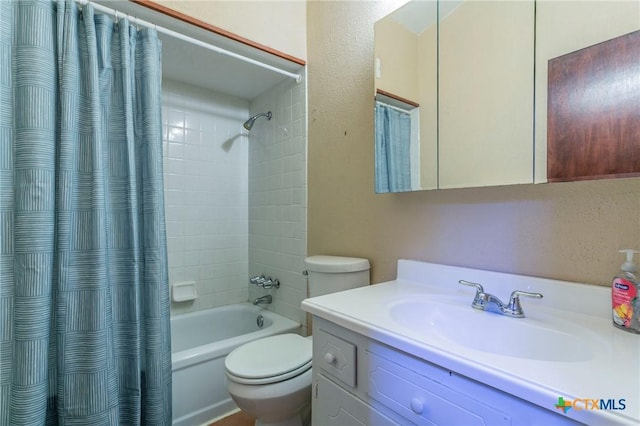 full bathroom with toilet, vanity, and shower / tub combo with curtain