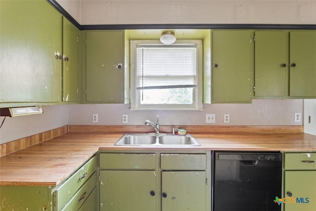 kitchen featuring black dishwasher, a sink, green cabinets, and light countertops