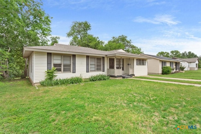 single story home featuring a front lawn and covered porch