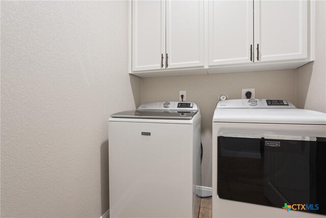 2085 Mercer St, Nolanville, TX 76559 - washroom featuring washing machine and dryer and cabinet space