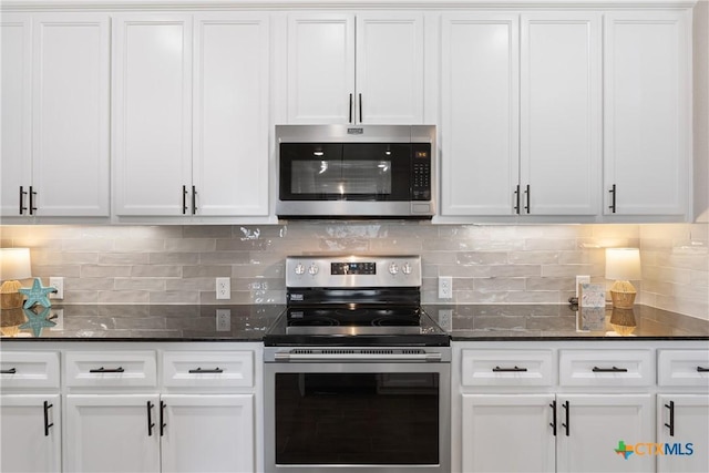 2085 Mercer St, Nolanville, TX 76559 - kitchen with appliances with stainless steel finishes, white cabinetry, decorative backsplash, and dark stone counters