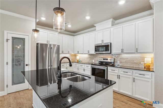 2085 Mercer St, Nolanville, TX 76559 - kitchen featuring appliances with stainless steel finishes, a sink, crown molding, white cabinets, and light wood finished floors