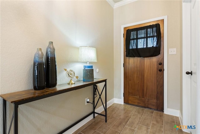 2085 Mercer St, Nolanville, TX 76559 - entrance foyer with baseboards, ornamental molding, and wood tiled floors