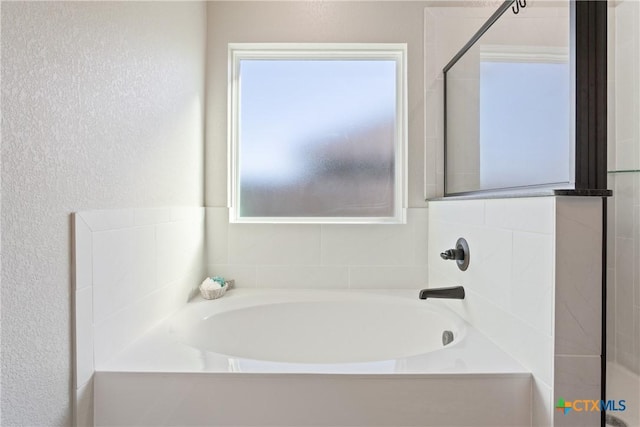 2085 Mercer St, Nolanville, TX 76559 - full bath featuring a garden tub and a textured wall
