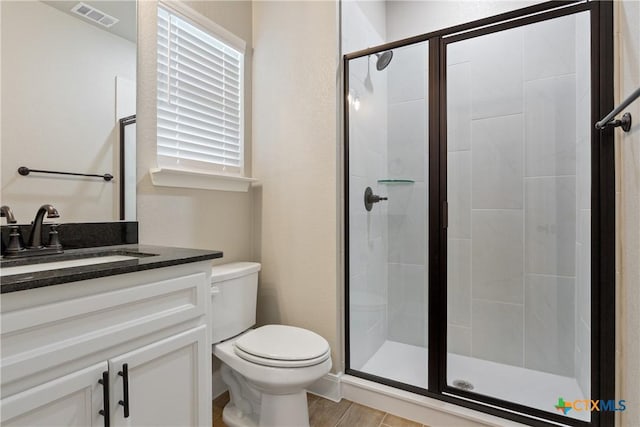 2085 Mercer St, Nolanville, TX 76559 - bathroom featuring toilet, a stall shower, and vanity
