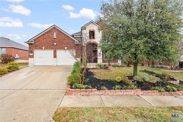 view of front of property featuring a garage, concrete driveway, brick siding, and stone siding