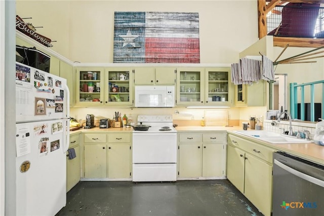 420 Mill Rd, Maxwell, TX 78656 - kitchen featuring white appliances, finished concrete flooring, a sink, and cream cabinetry
