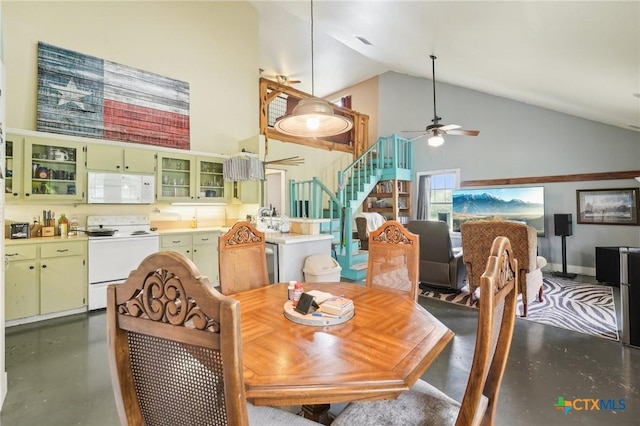 420 Mill Rd, Maxwell, TX 78656 - dining space with high vaulted ceiling, stairway, concrete flooring, and a ceiling fan