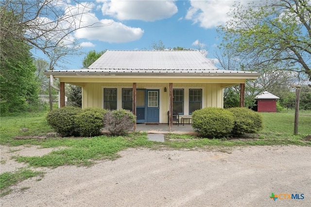 420 Mill Rd, Maxwell, TX 78656 - back of house featuring a porch, board and batten siding, and metal roof