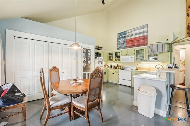 420 Mill Rd, Maxwell, TX 78656 - dining area with concrete floors and high vaulted ceiling
