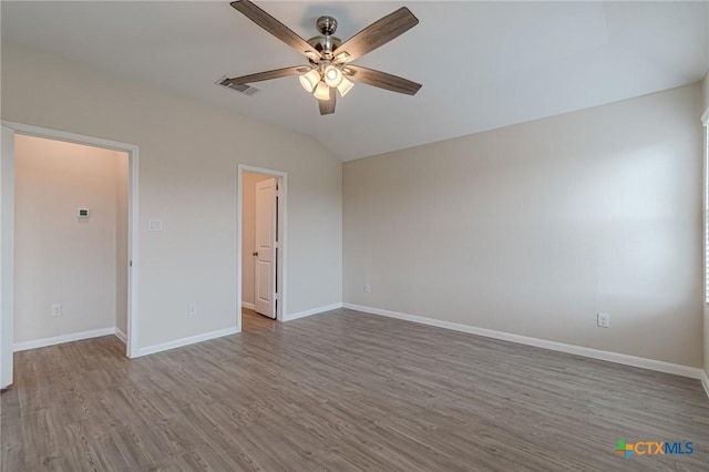 2824 Green Finch, New Braunfels, TX 78130 - unfurnished bedroom featuring wood finished floors, baseboards, lofted ceiling, and a ceiling fan
