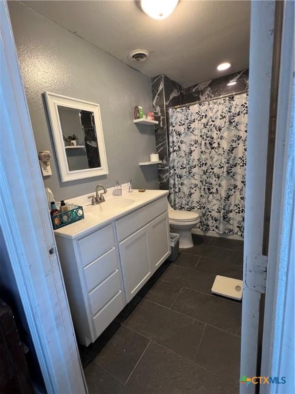 full bathroom with visible vents, tile patterned flooring, vanity, toilet, and a shower with curtain