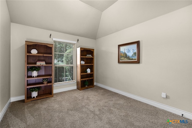 959 Wilderness Trl, New Braunfels, TX 78132 - empty room featuring carpet flooring, baseboards, and vaulted ceiling