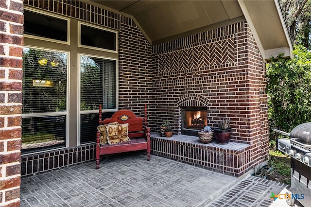 959 Wilderness Trl, New Braunfels, TX 78132 - view of patio / terrace with an outdoor brick fireplace and grilling area