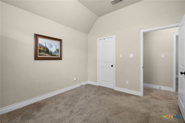 959 Wilderness Trl, New Braunfels, TX 78132 - unfurnished bedroom featuring lofted ceiling, carpet floors, and baseboards