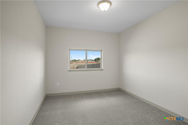 spare room with carpet floors