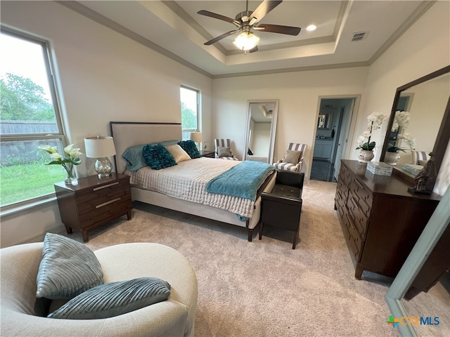 2010 Seguin Ave, Victoria, TX 77901 - bedroom with light carpet, a raised ceiling, crown molding, a walk in closet, and ceiling fan