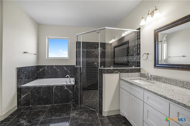 bathroom featuring vanity and separate shower and tub