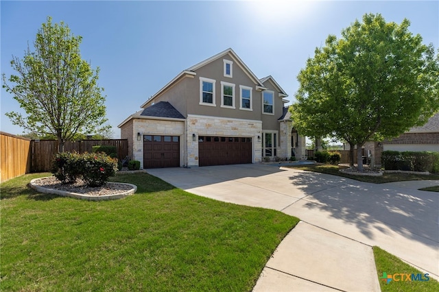 3437 De Soto Loop, Round Rock, TX 78665 - traditional-style house with stone siding, concrete driveway, a garage, and stucco siding