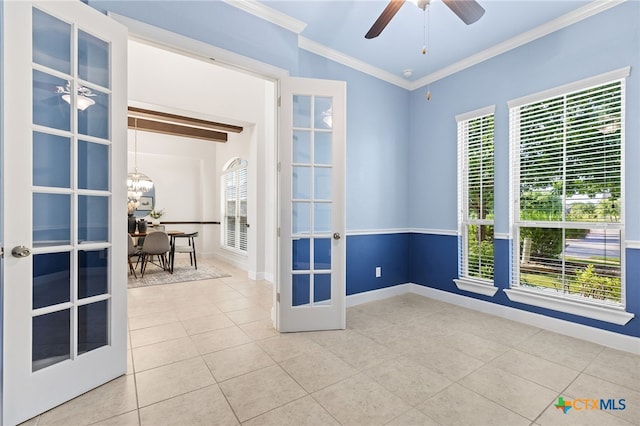 3437 De Soto Loop, Round Rock, TX 78665 - unfurnished room with tile patterned floors, ornamental molding, healthy amount of natural light, french doors, and baseboards