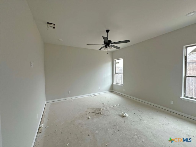 empty room with baseboards and a ceiling fan