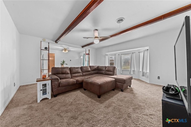 living room with carpet flooring, beam ceiling, and ceiling fan