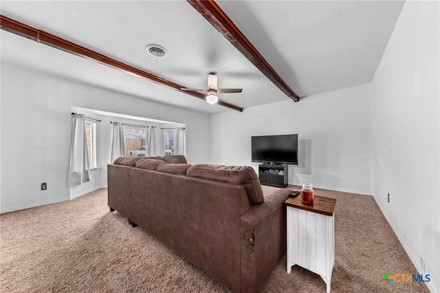 living room with carpet, beam ceiling, and ceiling fan