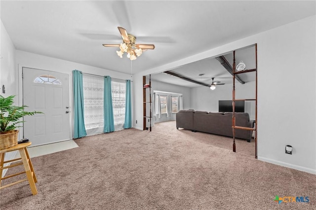 carpeted living room with french doors and ceiling fan