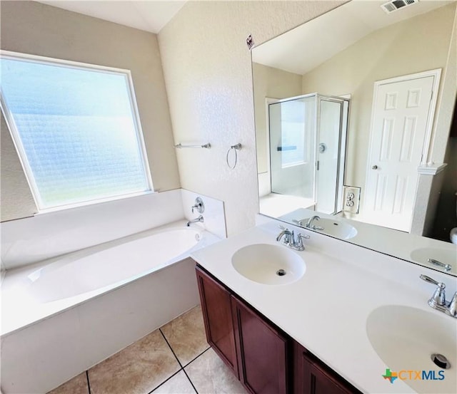 bathroom featuring tile patterned flooring, vanity, and independent shower and bath