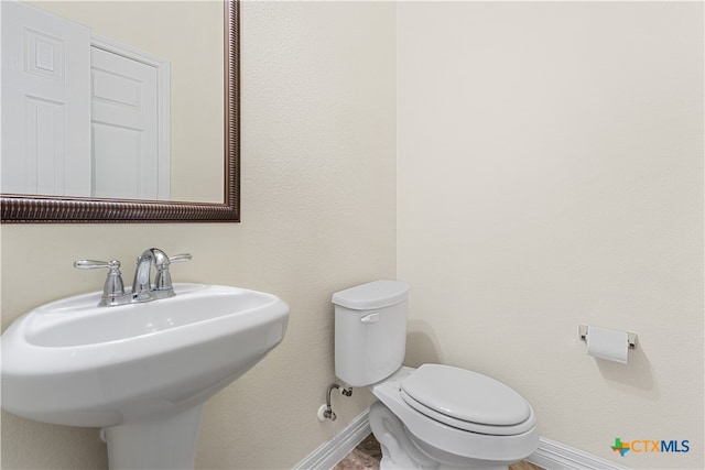 bathroom featuring toilet