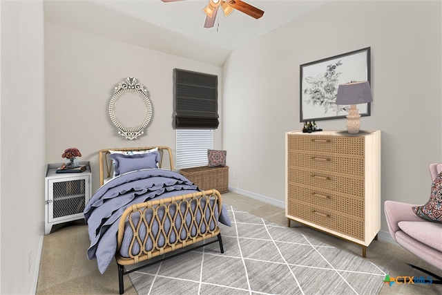 bedroom featuring ceiling fan, carpet floors, and lofted ceiling