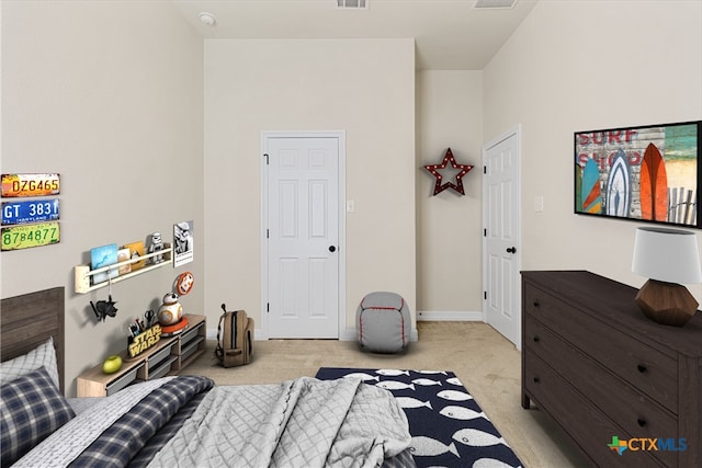 bedroom with light carpet