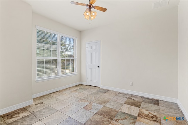 spare room with ceiling fan