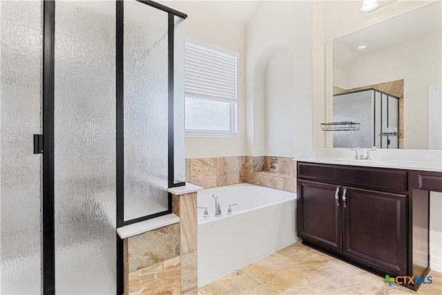 bathroom with vanity, lofted ceiling, and plus walk in shower