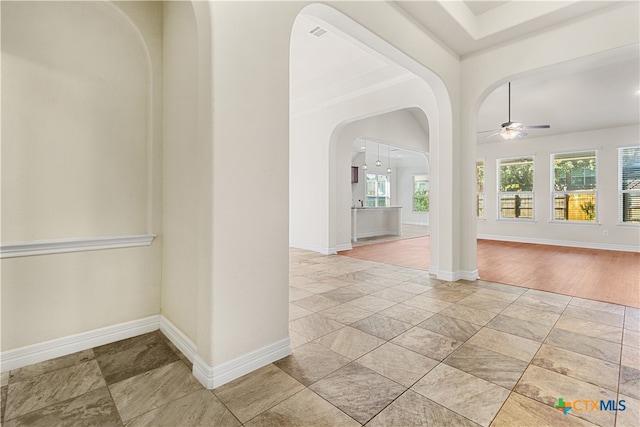 entrance foyer with ceiling fan and light hardwood / wood-style floors