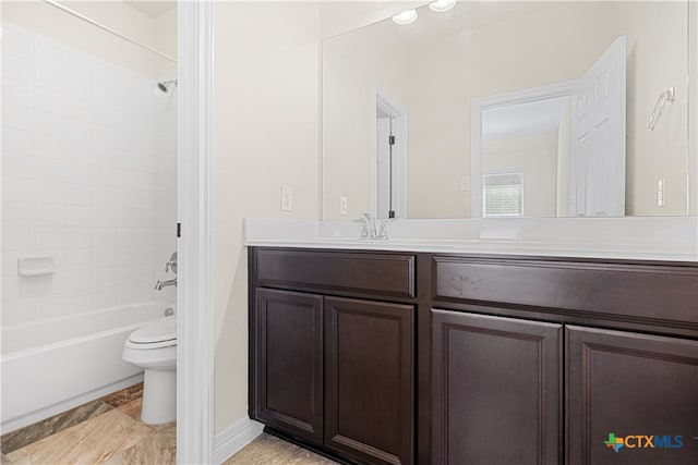 full bathroom with tiled shower / bath combo, toilet, and vanity