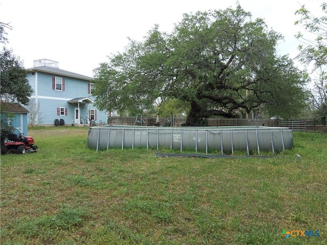 618 Pecos St, Lockhart, TX 78644 - view of yard with fence and a fenced in pool