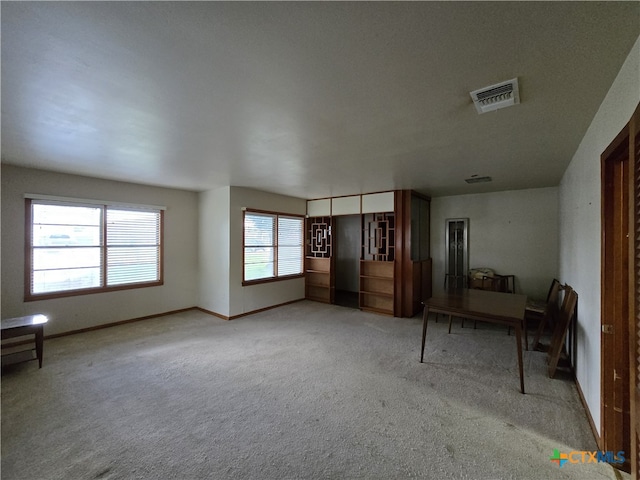 220 Davis Ave, Port Lavaca, TX 77979 - unfurnished living room with carpet flooring and baseboards