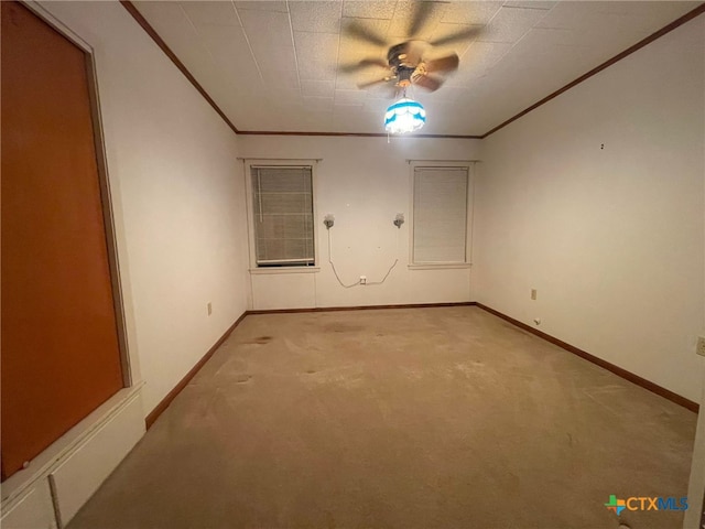 220 Davis Ave, Port Lavaca, TX 77979 - spare room featuring ornamental molding, light colored carpet, baseboards, and ceiling fan