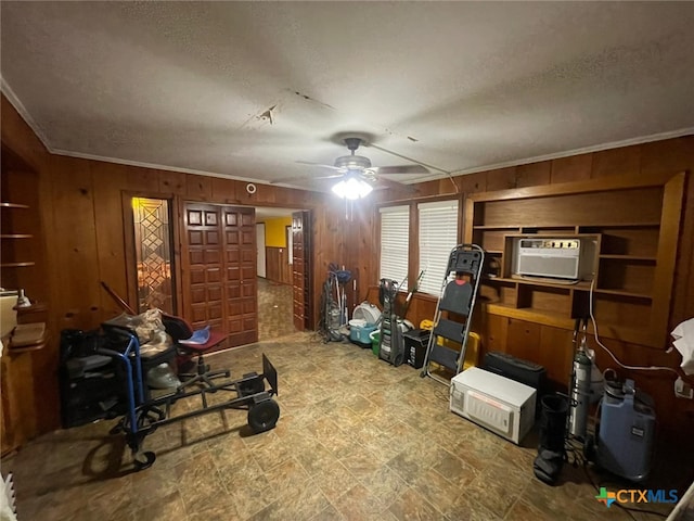 220 Davis Ave, Port Lavaca, TX 77979 - interior space featuring wooden walls, a ceiling fan, a textured ceiling, crown molding, and a wall mounted air conditioner
