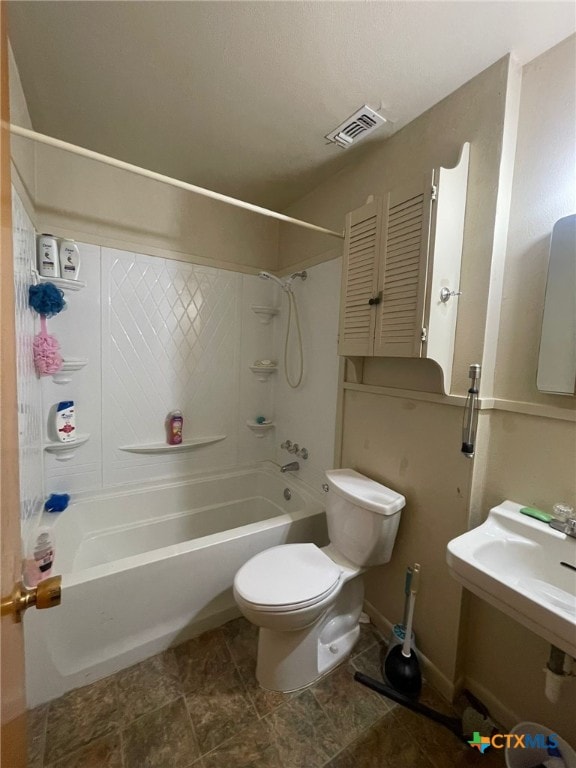 220 Davis Ave, Port Lavaca, TX 77979 - full bath with  shower combination, toilet, and baseboards