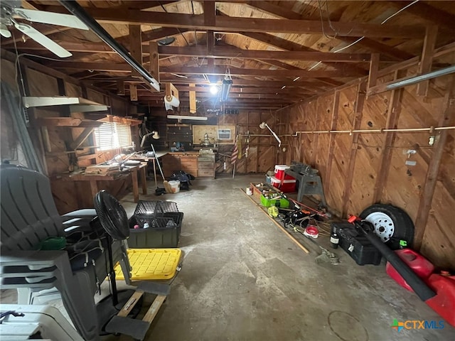 220 Davis Ave, Port Lavaca, TX 77979 - garage with a workshop area and wooden walls