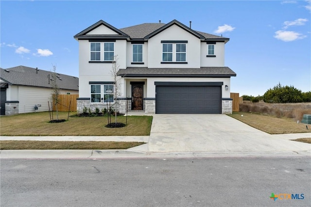 view of front of house with a front lawn and a garage