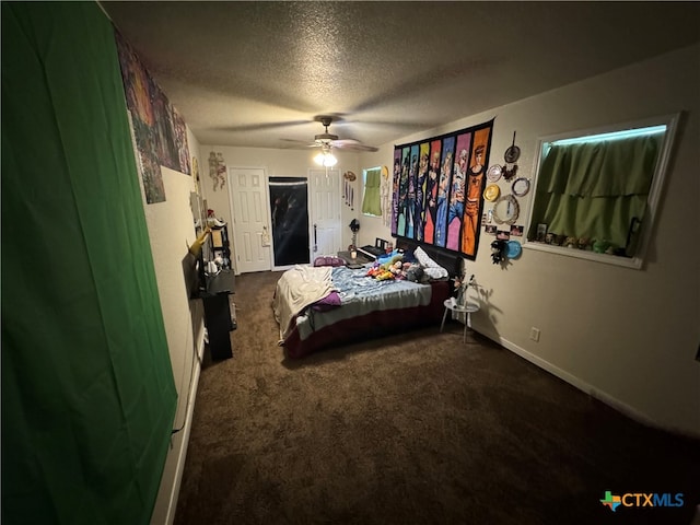 bedroom featuring a textured ceiling, carpet flooring, and ceiling fan