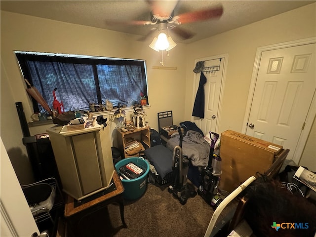 interior space featuring ceiling fan