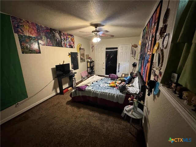 bedroom featuring carpet, a textured ceiling, and ceiling fan