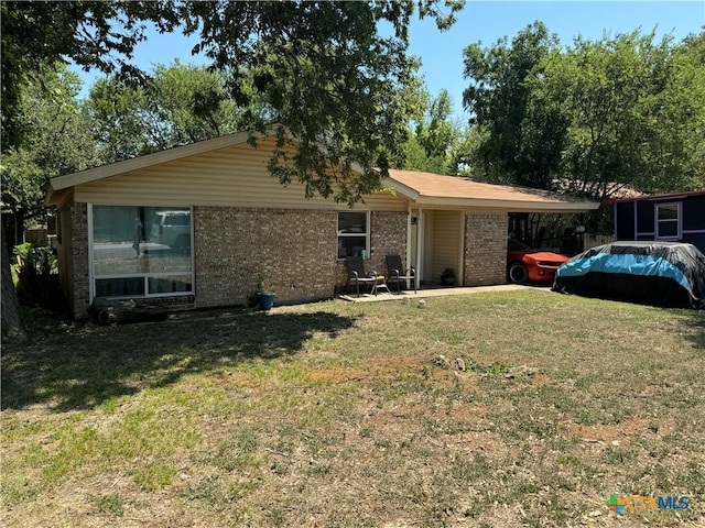 ranch-style house with a front lawn