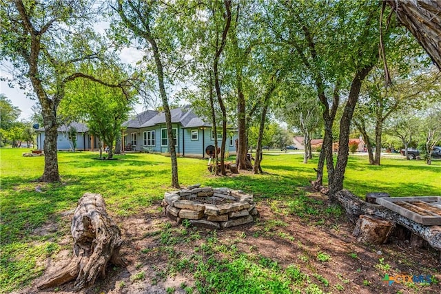425 County Road 3830, San Antonio, TX 78253 - view of green lawn featuring an outdoor fire pit