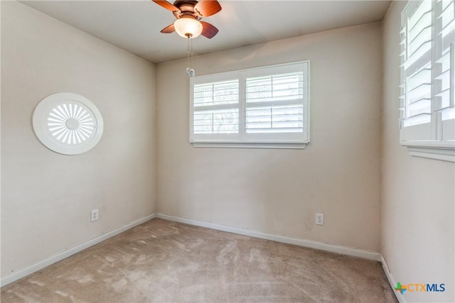 425 County Road 3830, San Antonio, TX 78253 - empty room with plenty of natural light, carpet flooring, ceiling fan, and baseboards